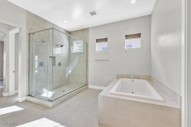 2170 Monte Bianco Pl, Henderson, NV 89044 - bathroom featuring a bath, a shower stall, and plenty of natural light