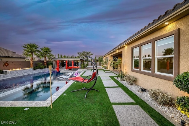 274 Chartan Ave, Las Vegas, NV 89183 - view of green lawn with an in-ground hot tub, an outdoor pool, and a patio area
