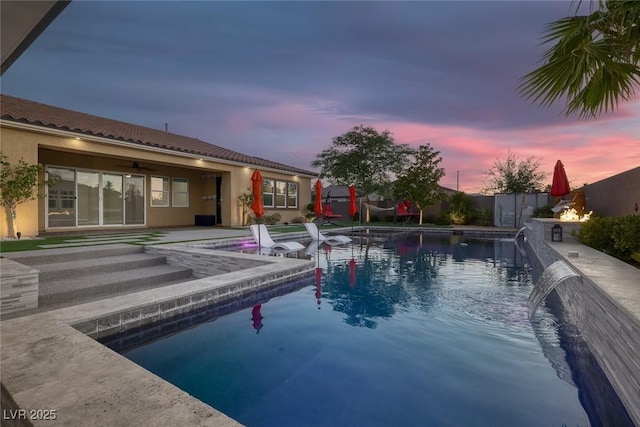 274 Chartan Ave, Las Vegas, NV 89183 - pool at dusk featuring ceiling fan and a patio