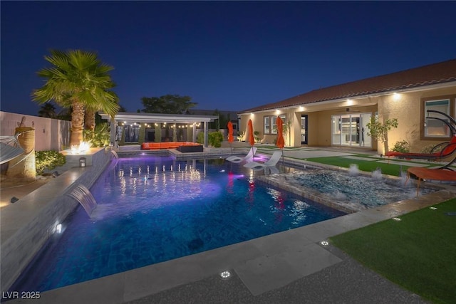 274 Chartan Ave, Las Vegas, NV 89183 - pool at night featuring a hot tub, an outdoor living space, and a patio
