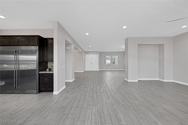 274 Chartan Ave, Las Vegas, NV 89183 - kitchen with built in fridge, open floor plan, light wood-style floors, dark brown cabinets, and recessed lighting