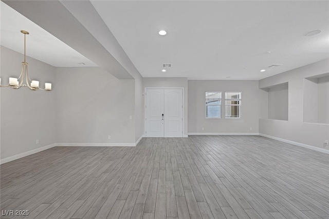274 Chartan Ave, Las Vegas, NV 89183 - unfurnished room with light wood-style floors, a chandelier, and recessed lighting