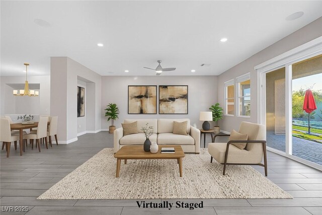 274 Chartan Ave, Las Vegas, NV 89183 - living room with a chandelier, healthy amount of natural light, wood finished floors, recessed lighting, and a ceiling fan
