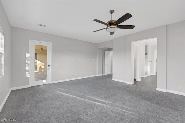 274 Chartan Ave, Las Vegas, NV 89183 - unfurnished bedroom with dark carpet, a ceiling fan, and connected bathroom