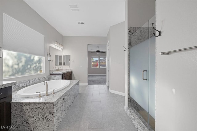 274 Chartan Ave, Las Vegas, NV 89183 - full bathroom featuring vanity, a shower stall, ceiling fan, a bath, and tile patterned flooring