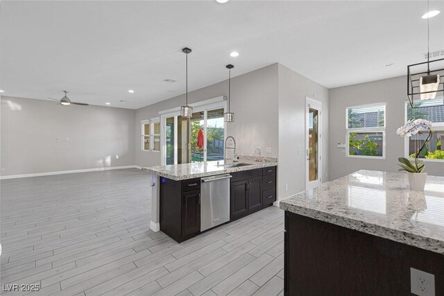 274 Chartan Ave, Las Vegas, NV 89183 - kitchen featuring stainless steel dishwasher, light wood finished floors, a ceiling fan, recessed lighting, and plenty of natural light