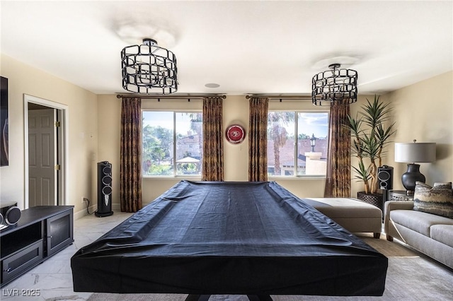 11005 Inverlochy Ct, Las Vegas, NV 89141 - recreation room with a chandelier, light marble finish flooring, and healthy amount of natural light