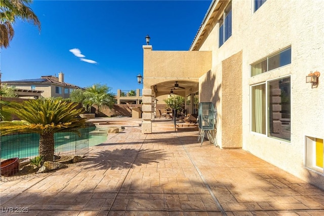 11005 Inverlochy Ct, Las Vegas, NV 89141 - fenced backyard featuring ceiling fan and a patio area