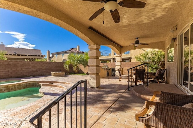 11005 Inverlochy Ct, Las Vegas, NV 89141 - fenced backyard featuring a patio area, a ceiling fan, and a pool with connected hot tub