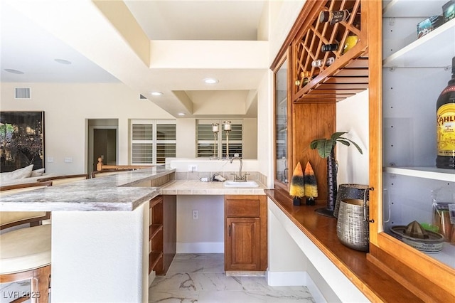 11005 Inverlochy Ct, Las Vegas, NV 89141 - bar featuring light marble finish flooring and recessed lighting