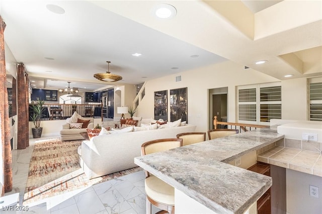 11005 Inverlochy Ct, Las Vegas, NV 89141 - living room featuring recessed lighting, a chandelier, and marble finish floors