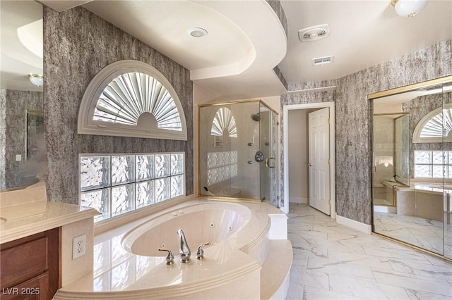11005 Inverlochy Ct, Las Vegas, NV 89141 - bathroom with marble look tiles, a tub with jets, a stall shower, and vanity