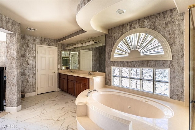11005 Inverlochy Ct, Las Vegas, NV 89141 - full bath featuring marble look tile flooring, a jetted tub, and vanity