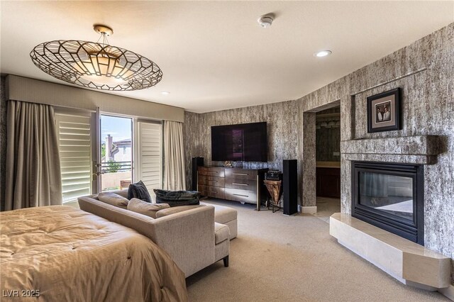 11005 Inverlochy Ct, Las Vegas, NV 89141 - bedroom featuring a glass covered fireplace, carpet floors, recessed lighting, and access to exterior