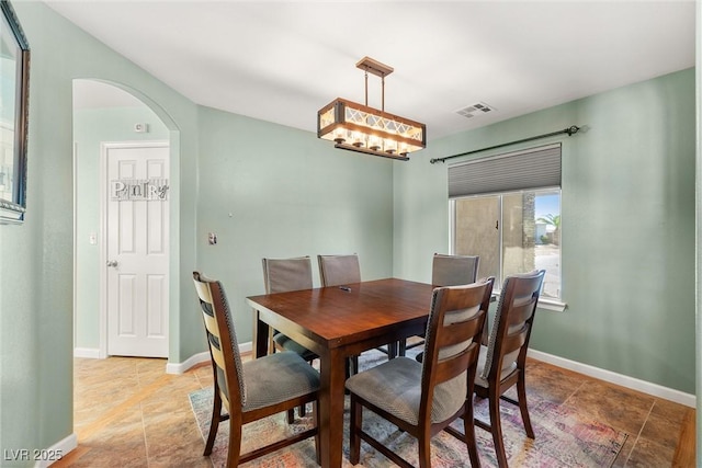 231 Bristle Cone, Pahrump, NV 89048 - dining area with arched walkways and light stone finish flooring