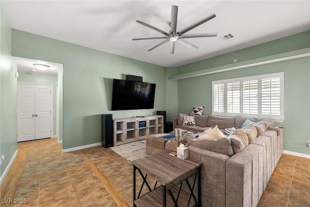 231 Bristle Cone, Pahrump, NV 89048 - living room featuring ceiling fan and baseboards