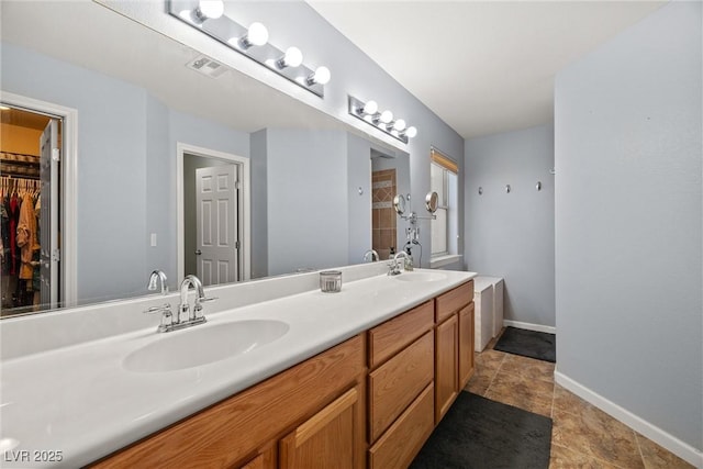 231 Bristle Cone, Pahrump, NV 89048 - bathroom featuring double vanity and baseboards
