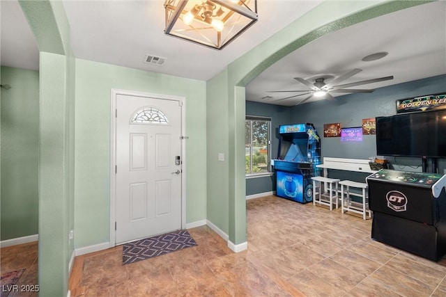 231 Bristle Cone, Pahrump, NV 89048 - foyer entrance with a ceiling fan, arched walkways, and a chandelier