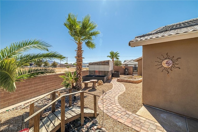 231 Bristle Cone, Pahrump, NV 89048 - fenced backyard with a jacuzzi and a patio area
