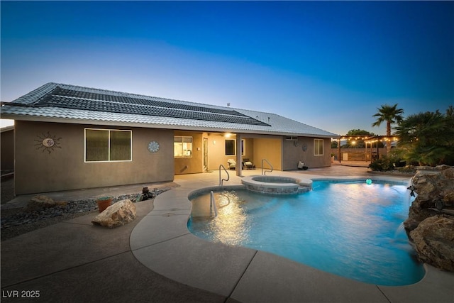 231 Bristle Cone, Pahrump, NV 89048 - rear view of property featuring a patio, a tiled roof, a pool with connected hot tub, and stucco siding