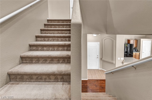 3757 Via Geneva, Henderson, NV 89052 - stairs featuring wood finished floors and a textured wall