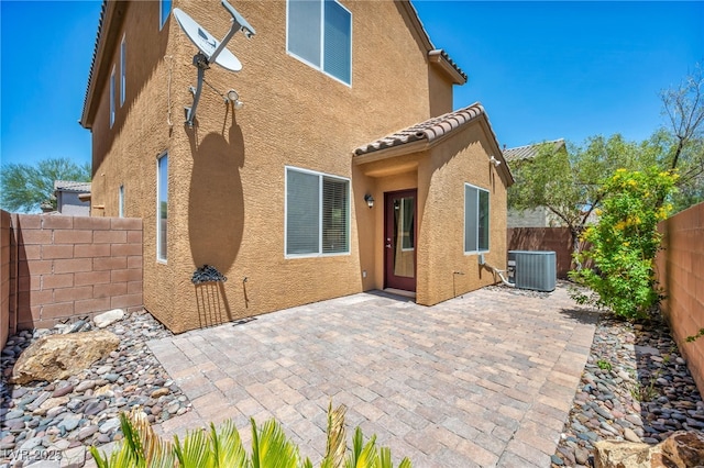 3757 Via Geneva, Henderson, NV 89052 - rear view of house with stucco siding, a fenced backyard, a patio, and a tile roof