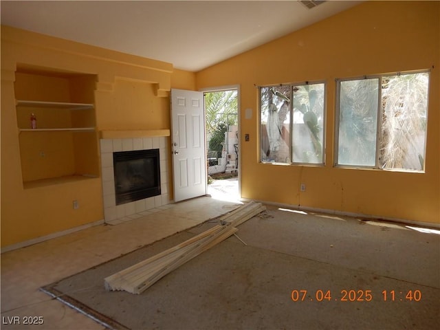 8151 Chambersberg St, Las Vegas, NV 89147 - unfurnished living room featuring vaulted ceiling and a fireplace