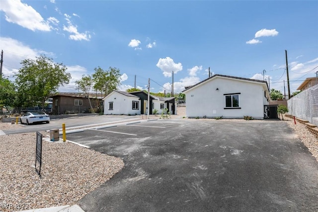 367 N 16th St, Las Vegas, NV 89101 - view of front of property with uncovered parking, stucco siding, and a residential view