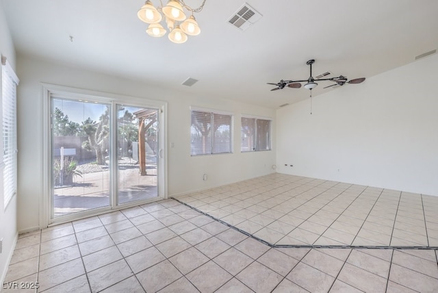 4010 Hemphill St, North Las Vegas, NV 89032 - spare room with a chandelier, a ceiling fan, and light tile patterned floors