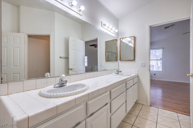 4010 Hemphill St, North Las Vegas, NV 89032 - full bath with double vanity and baseboards