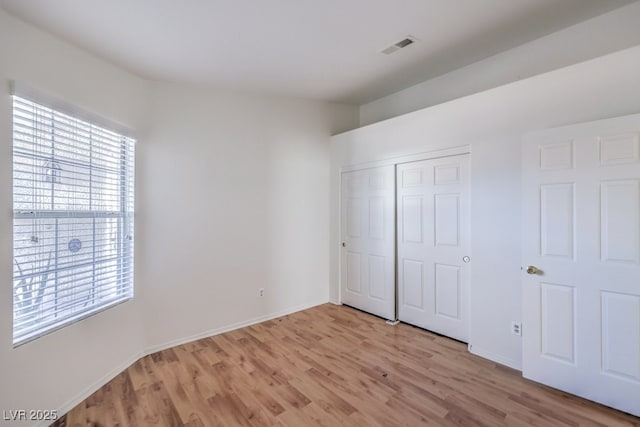 4010 Hemphill St, North Las Vegas, NV 89032 - unfurnished bedroom with light wood-style flooring and a closet