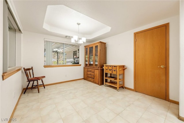 2040 Tucuman Ave, Pahrump, NV 89048 - dining space featuring a chandelier, a raised ceiling, and light flooring