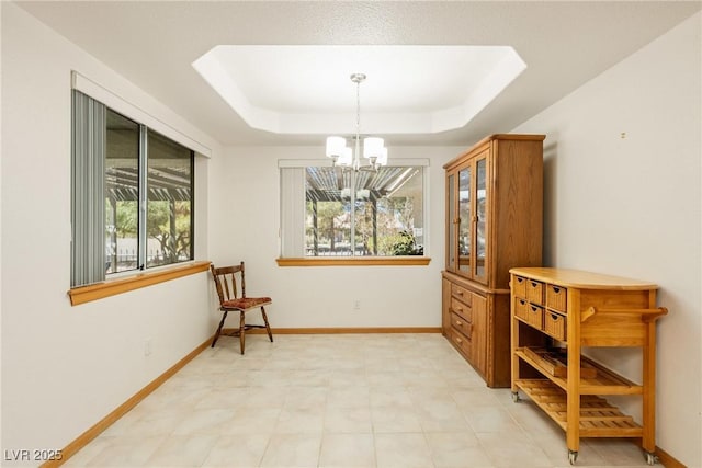 2040 Tucuman Ave, Pahrump, NV 89048 - sitting room featuring a chandelier, a tray ceiling, and light flooring