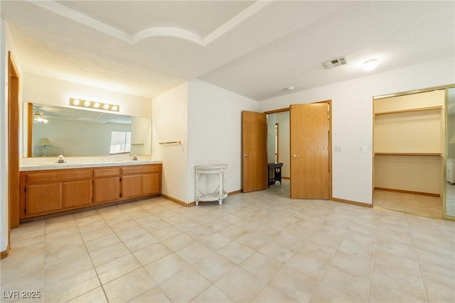 2040 Tucuman Ave, Pahrump, NV 89048 - bathroom featuring double vanity and baseboards