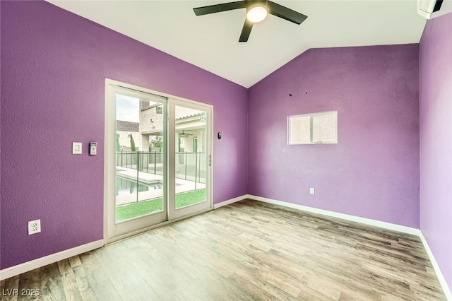 5990 Viscaya Grove St, Las Vegas, NV 89118 - empty room with healthy amount of natural light, wood finished floors, ceiling fan, vaulted ceiling, and a textured wall