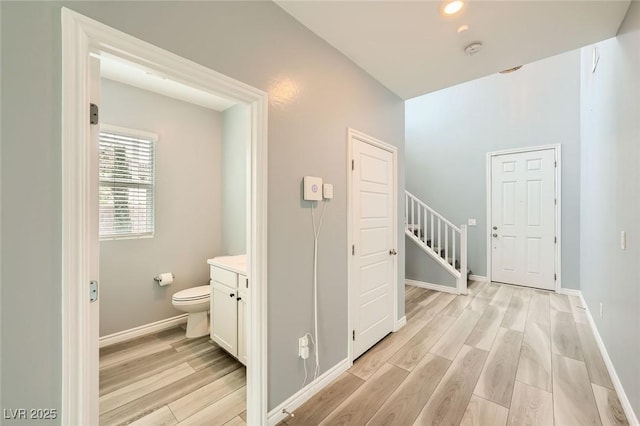 5990 Viscaya Grove St, Las Vegas, NV 89118 - hallway featuring light wood-type flooring and baseboards