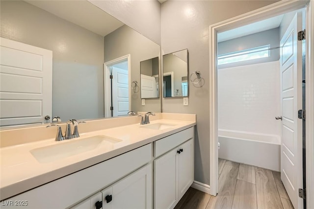 5990 Viscaya Grove St, Las Vegas, NV 89118 - bathroom featuring double vanity, wood finished floors, and shower / tub combination