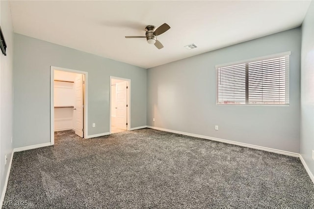 5990 Viscaya Grove St, Las Vegas, NV 89118 - unfurnished bedroom with a spacious closet, carpet flooring, a closet, and a ceiling fan