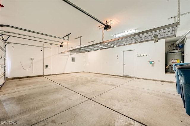 5990 Viscaya Grove St, Las Vegas, NV 89118 - garage with strapped water heater and a garage door opener