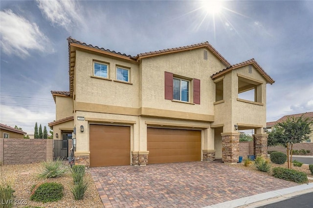 5990 Viscaya Grove St, Las Vegas, NV 89118 - view of front of property with stucco siding, an attached garage, a tiled roof, decorative driveway, and stone siding