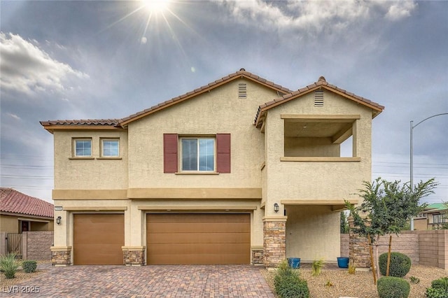 5990 Viscaya Grove St, Las Vegas, NV 89118 - view of front of property with stucco siding, an attached garage, decorative driveway, a tiled roof, and stone siding