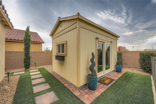 5990 Viscaya Grove St, Las Vegas, NV 89118 - view of outdoor structure with a fenced backyard and french doors