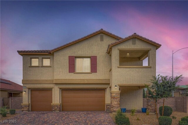 5990 Viscaya Grove St, Las Vegas, NV 89118 - view of front of property featuring stucco siding, an attached garage, decorative driveway, and a tiled roof