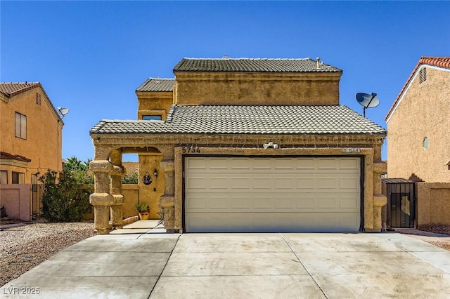 5754 Cinnabar Ave, Las Vegas, NV 89110 - view of front of property with concrete driveway, a tiled roof, and a garage