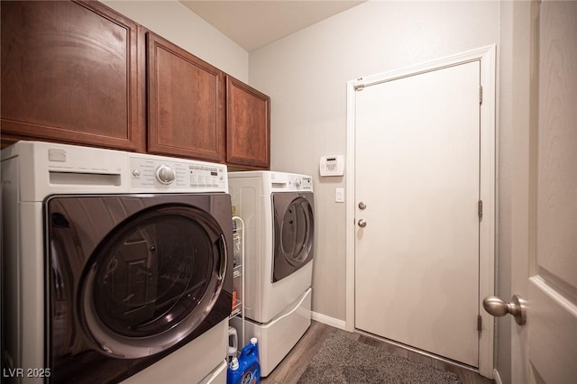 7252 Blowing Breeze Ave, Las Vegas, NV 89179 - washroom with separate washer and dryer, dark wood finished floors, and cabinet space