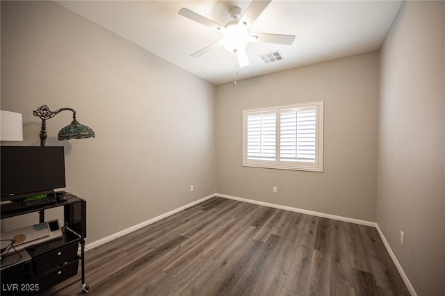 7252 Blowing Breeze Ave, Las Vegas, NV 89179 - spare room featuring a ceiling fan and dark wood-style flooring