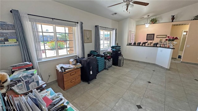4910 Marywood Ct, Pahrump, NV 89061 - dining area with a ceiling fan, vaulted ceiling, and light tile patterned floors