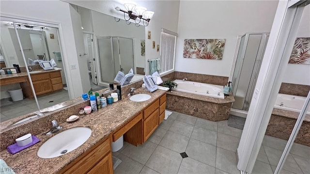 4910 Marywood Ct, Pahrump, NV 89061 - full bath featuring a stall shower, double vanity, a jetted tub, tile patterned flooring, and a high ceiling