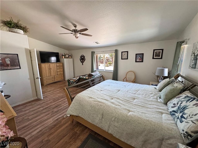 4910 Marywood Ct, Pahrump, NV 89061 - bedroom featuring wood finished floors, lofted ceiling, and a ceiling fan