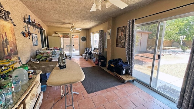 4910 Marywood Ct, Pahrump, NV 89061 - living area with a ceiling fan, healthy amount of natural light, and a textured ceiling